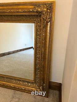 Large ornate gold / gilt framed wall mirror