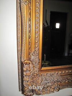 Mirror -large decorative wall type in dark gold