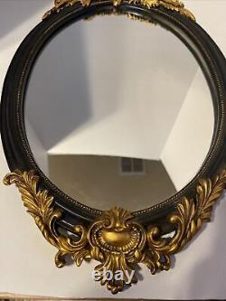 Vintage Mid Century Oval Wall Mirror with Gold Color Ornate Frame. (Trkng ALST)
