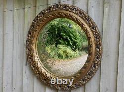 Wall mirror for living room. Concave glass. Gold decorated frame. 47cm Dia
