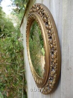 Wall mirror for living room. Concave glass. Gold decorated frame. 47cm Dia