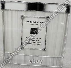 White Jo Malone candle bottle English Pear, liquid art & mirror frame pictures