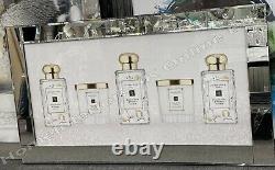 White & gold Jo candle cologne bottles with crystals & mirror frame pictures