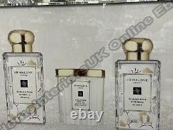 White & gold Jo candle cologne bottles with crystals & mirror frame pictures